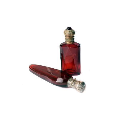 A silver mounted ruby glass scent bottle,  together with a brass topped example (2) 