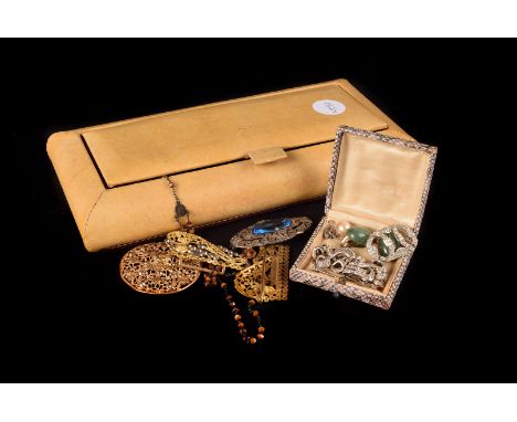 An Art Deco double clip brooch, together with a pair of green Jade earrings, rosary beads and more,  in a beige hide jeweller