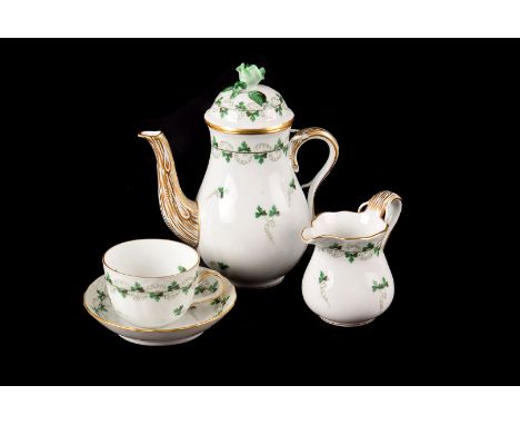 A Herend part tea set, in green Rose and  twining ivy pattern, consisting of tea pot, milk and sugar 3 side plates, 7 cups an