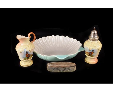 A Locke & Co Worcester porcelain sugar caster and milk jug, the caster having a silver top, both with pheseant decoration, to