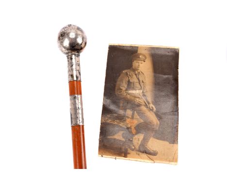 A WWI silver topped Commanding Officer's swagger stick, won by Private E.W.TAYLOR ''C'' COMPANY, together with a black and wh