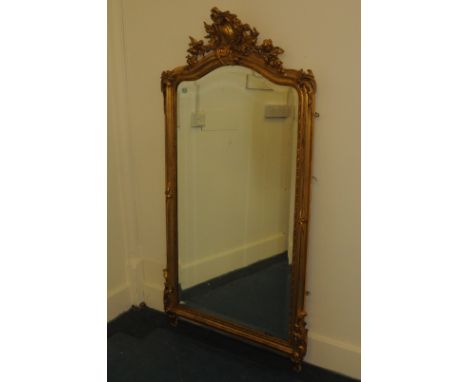 A large gilt mirror, with C Scroll and ornate surround, 157cm high 