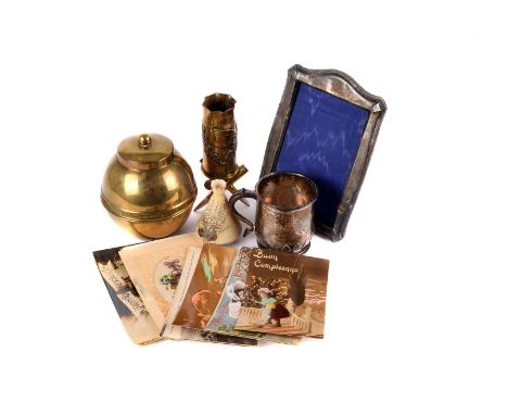 A collection of various military related and other items, including trench art, a small silver tankard, silver photograph fra