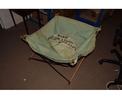 A WWII Canvas bath/basin, the adjustable wooden frame holding the canvas bath and basin bags, marked MajorC.G.HILLIARD ROYAL 