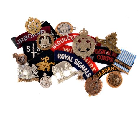 A United Nations Korea Service medal, together with an assortment of various cap and cloth badges and buttons, including The 