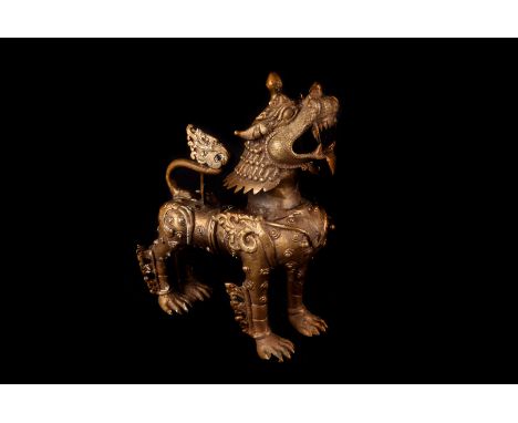 A vintage Indian brass censor, in the form of a Chinese Bhuddist lion 