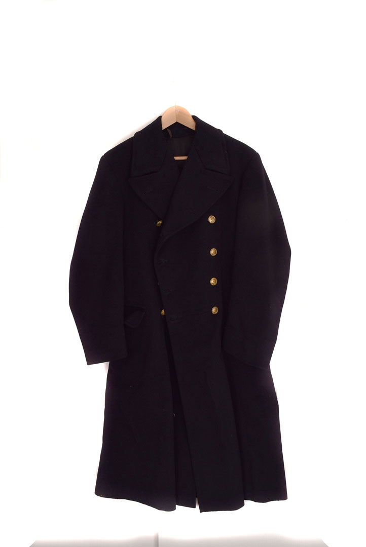 A WWII Royal Navy greatcoat, the full length black coat with four gilt ...