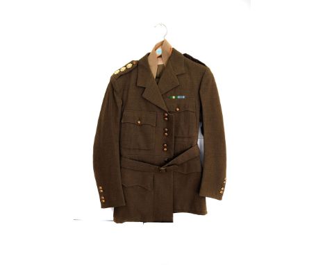 A Coldstream Guards Captain's uniform jacket, plus trousers, together with peak cap and silver topped swagger stick (4) 