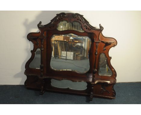A Victorian mahogany chiffonier upper section, the ornate shaped piece probably from a larger item of furniture with covered 