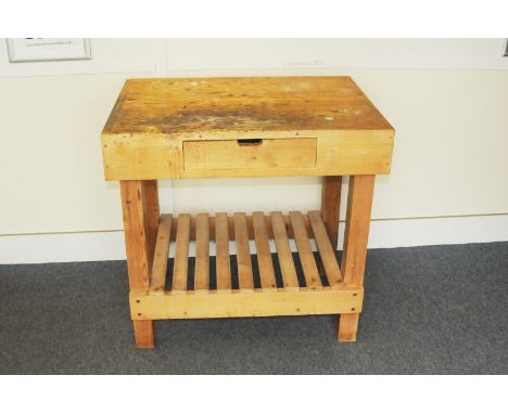 A vintage pine butcher's block base, having drawer to top section and shelved lower 