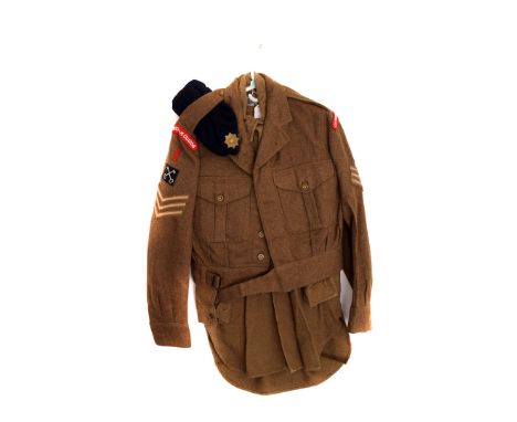 A 1950's British Army Coldstream Guards Battle Dress, in the 1944 pattern, with Sergeant patches, comprising jacket, trousers