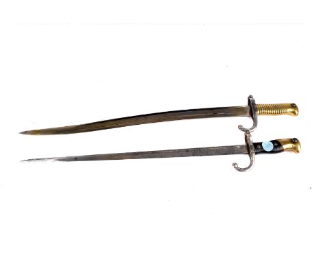 A late 19th century French T-back sword bayonet, inscribed to the back of blade, and makers marks to the guard, together with