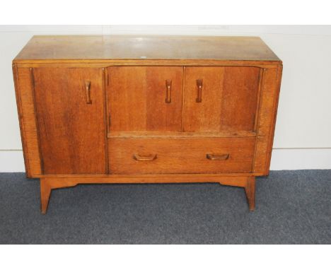 A 1960s teak G-Plan style sideboard, with doors and drawer to lower section, supporting a shelf section, AF 