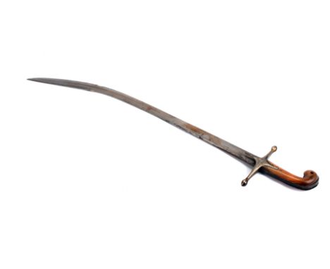 An Indian sabre, having carved decoration to the hand guard, leading to a long curved blade, in decoratively etched scabbard,