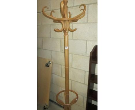 A light wood coat and umbrella stand