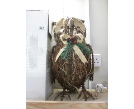 A boxed wicker owl model