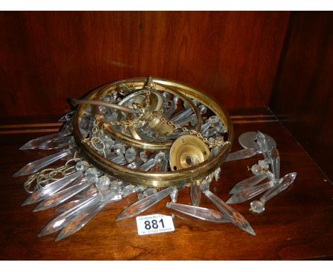 An old hanging light fitting with droppers