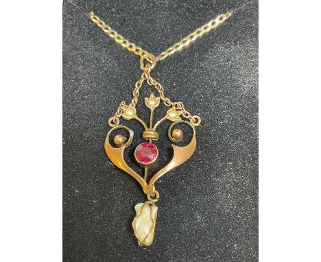 An Edwardian Art Nouveau 9ct rose gold garnet and seed pearl pendant suspended on a contemporary 9ct yellow gold chain, combi