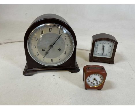 A vintage bakelite Enfield mantel clock, a Smith's electric bakelite mantel clock and one other.