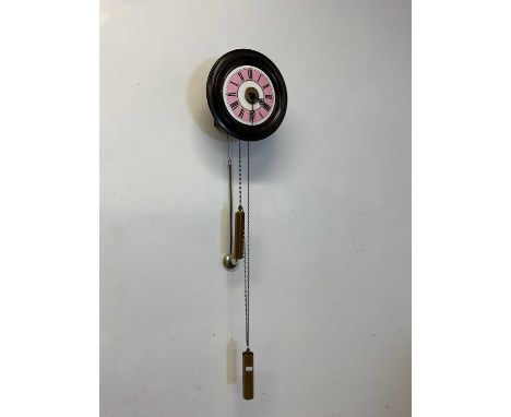 An early 20th century circular Post Office clock with Roman numerals to the chapter ring and sold with two brass weights, dia