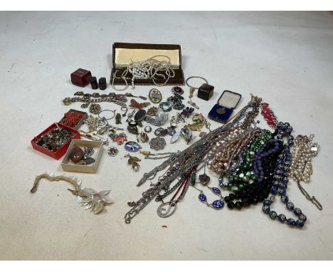 A quantity of costume jewellery including necklaces, brooches, earrings and some silver items