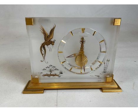 JAEGER-LECOULTRE: a Marina mantel clock, rectangular perspex form with gilt hour markers and gilt Oriental bird and tree deco