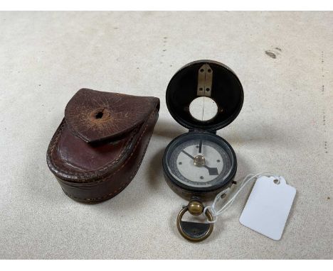 A WWII period leather cased pocket compass.