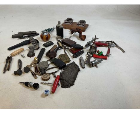 A collection of corkscrews, pen knives, nut crackers and smoker's items including a carved bull head pipe, snuff boxes