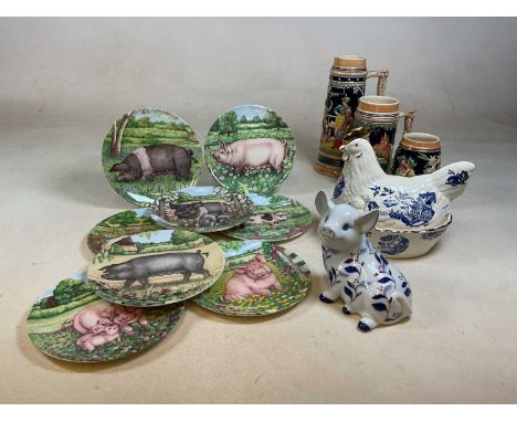 A collection of mixed ceramics including three Continental beer steins, collector's Royal Doulton pig plates, a hen on nest e