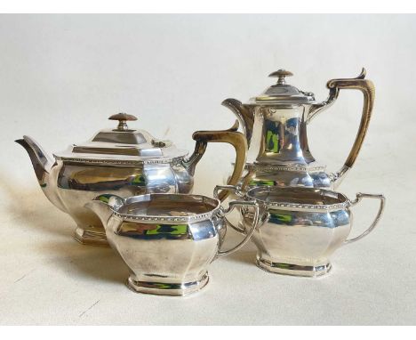 COOPER BROS AND SONS; a hallmarked silver four piece tea set comprising teapot, water jug, sugar bowl and milk jug, Sheffield