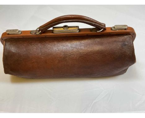 A small vintage leather 'Gladstone' bag complete with key, length 40cm