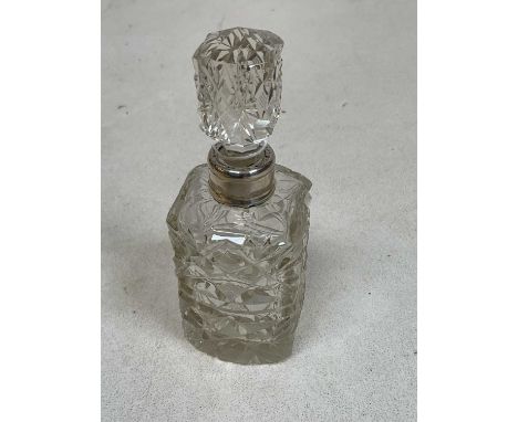 A George V hallmarked silver collared cut glass scent bottle with stopper, London 1922, height 12cm