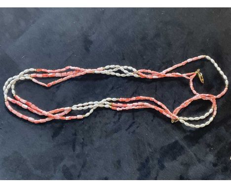 A coral and pearl three strand necklace, length 60cm.