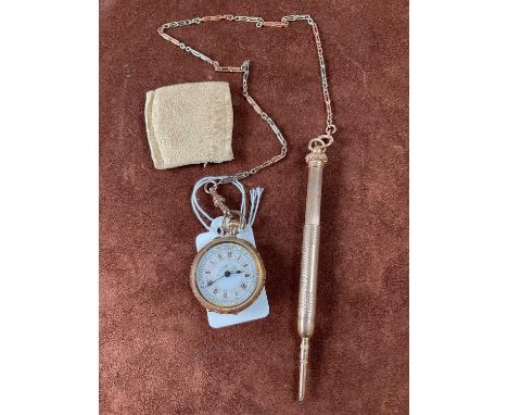 An 18ct gold fob watch with Roman numerals to the white enamel dial and floral engraved case with gold cuvette suspended on a