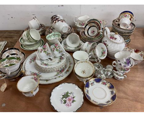 A Royal Albert part teaset 'Moss Roses', a quantity of cabinet cups and saucers, a hand painted and gilded part tea set and a