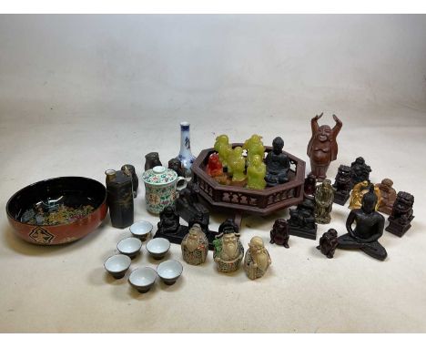 A quantity of Oriental items including Buddhas, ceramic saki set, three wise monkeys and other items
