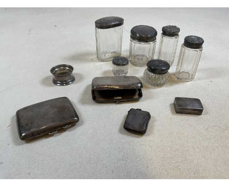 A collection of hallmarked silver cigarette and vesta cases, a napkin ring and silver and white metal topped dressing table i