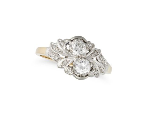 A DIAMOND RING in yellow gold, set with two round brilliant cut diamonds, accented by single cut diamonds, no assay marks, si