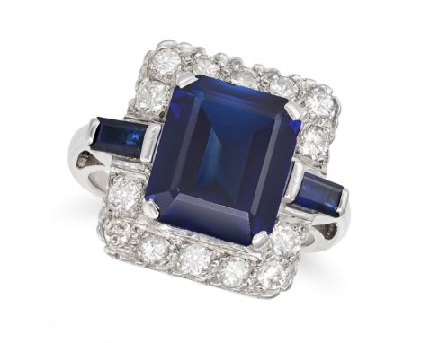 A SYNTHETIC SAPPHIRE AND DIAMOND DRESS RING in 14ct white gold, set with an octagonal step cut synthetic sapphire of 6.35 car