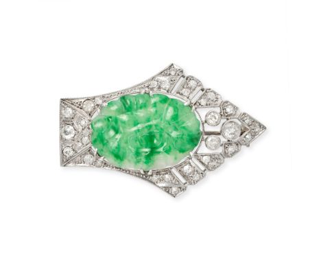 A VINTAGE JADEITE JADE AND DIAMOND BROOCH in 18ct white gold, set with a carved piece of jadeite jade to a stylised border of
