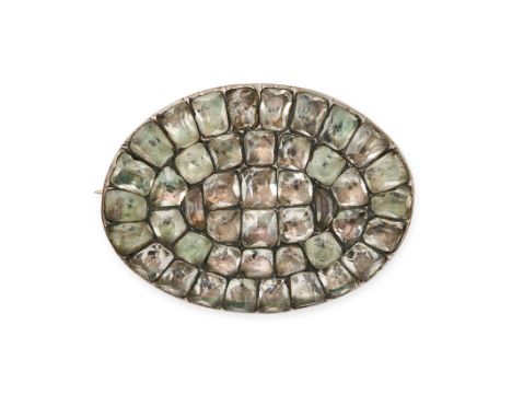 AN ANTIQUE PORTUGUESE CHRYSOLITE BROOCH in silver, the oval body set throughout with calibre cut chrysolites, no assay marks,