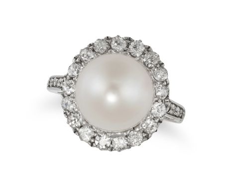 A PEARL AND DIAMOND RING in white gold, set with a pearl of 10.4mm in a cluster of old cut diamonds, further old cut diamonds