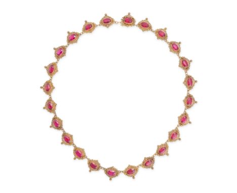 A SYNTHETIC RUBY RIVIERE NECKLACE set with a row of twenty four oval cut synthetic rubies in scrolling borders, GR maker's ma