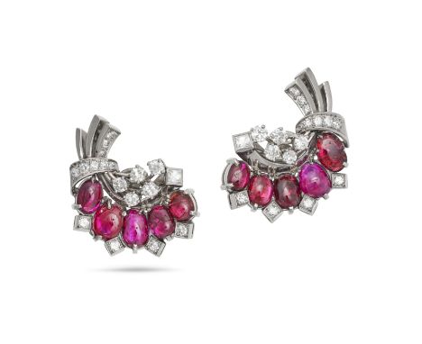 A PAIR OF VINTAGE RUBY AND DIAMOND CLIP EARRINGS in platinum, each in a scrolling foliate design set with five oval cabochon 