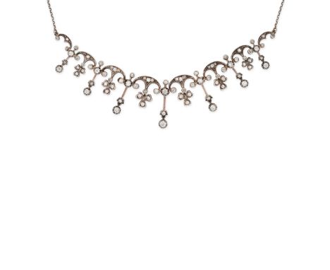 AN ANTIQUE DIAMOND FRINGE NECKLACE in yellow gold and silver, designed with clover motifs set throughout with old cut diamond