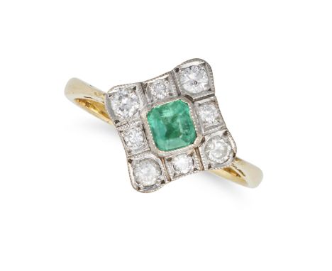 AN EMERALD AND DIAMOND RING in 18ct yellow gold, set with an octagonal step cut emerald in a border of round brilliant cut di