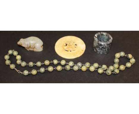 A SMALL CHINESE WHITE JADE CARVING OF THE THREE LEGGED TOAD, 1.9in long; together with a pierced jade-like Bi disc, 2.4in dia