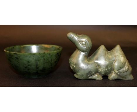 A CHINESE JADE BOWL, the predominantly green stone with darker and lighter inclusions, 4.8in diameter & 2.3in high; together 