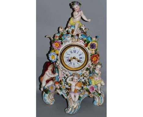 A VERY GOOD 19TH CENTURY GERMAN PORCELAIN MANTLE CLOCK with eight day movement, striking on a single bell, in a case with fou