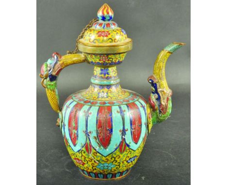 A LATE 19TH CENTURY CHINESE TIBETAN MARKET CLOISONNE EWER & COVER, the sides with a design of dependent lappets reserved on a